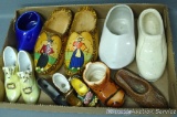 Wooden wall hanging clogs are marked 'Made in Holland'; four other shoe style planters up to 6-1/2