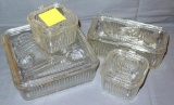Four piece set of glass vegetable pattern refrigerator dishes with lids. Set includes an 8