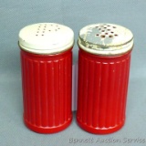 Fun red glass salt and pepper shaker set. Each piece stands 4-1/4