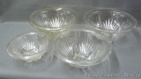 Set of three nesting glass serving or mixing bowls, plus another matching of the largest size.