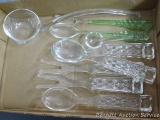 Glass serving utensils including a pair of green glass handled spoon and fork; Also three glass