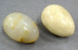One stone egg and one wooden egg, each about 2-1/2