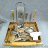 Porcelain jar funnel, grater, slotted spoon, Price County Lumber Co promotional tongs, rolling pin,