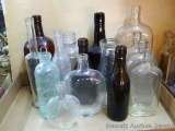 Assortment of neat old glass bottles. Tallest is 10-1/2