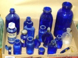 Cobalt blue bottle collection would look great lining a sunny window sill. Tallest bottle is 8-3/4