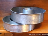 Two heavy duty Cream City cake pans - one with insert. Both pans are 10-1/4