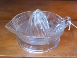 Clear glass juicer or reamer has a basket weave design and measures 8