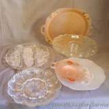 Assorted pressed glass pieces including cake stand and serving platters, relish dishes, deviled egg