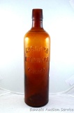 Cast amber medicine bottle is nearly 11