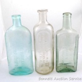 Three old medicine bottles. Dr. Pierce's Golden Medical Discovery, Dr. Peter Fahrney, and Lydia