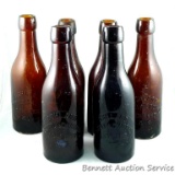 Six cast beer bottles from Ashland Bottling Works, Ashland Wis. In pretty good condition for dump