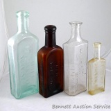 Four old bottles including Dr. Mile's Restorative Nervine; S.W. Ford Druggist of Oconto, Wis.;