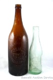 Large and small bottles from Park Falls Bottling Works, Park Falls, Wis. Largest is 12