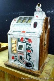 Antique Mills Novelty Co. Poinsettia nickel slot machine still works. Approx. 16