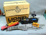 Lionel No. 6670 crane car; Lionel Alaska Railroad hopper car No. 6636; straight and curved track;