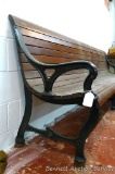 Antique oak and cast iron bench is thought to be out of the old courthouse. 9' long and nearly 3'