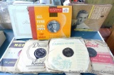 Old vinyl records by Ernest Tubb, Eddie Arnold and the like. Pile as pictured is 5