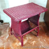 Nice little wicker side table with magazine or book rack on the bottom. Measures 25