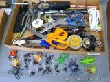 Junk drawer contents including scissors, hammer, staples, flashlight, pliers, clips, more.