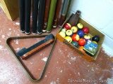 Ten pool cues by St. Croix, Maverick and others, plus some pool balls, rack, brush, chalk, etc.