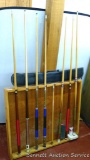 Seven pool cues. Three have tips, plus a wall rack, soft case, more.
