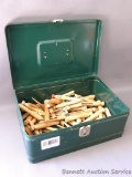 Climax brand metal storage box with a handful or two of heavy duty vintage wooden clothespins. Box