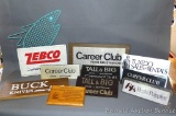 Zebco, Career Club, Hush Puppies, Buck Knives, Tropic Tuxedo, and other store signs up to 14