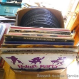 Stack of old records is one foot tall. Assorted genres.