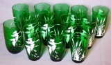 Twelve green glass tumblers depicting flying ducks, plus one other similar. Note found with glasses