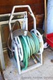 Suncast hose reel with two lengths of garden hose, plus a sturdy wall mount hose bracket. Hose reel
