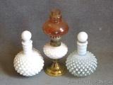Two hobnail decanters, plus a little oil lamp. Decanters stand approx. 6