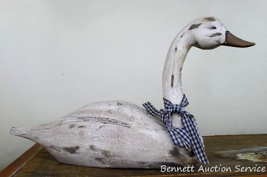 Adorable wooden goose with a navy & white gingham bow; measures 22" x 6" x 12" tall.