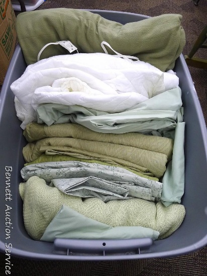Tote filled with electric blanket, mattress pad, green sheets, blankets and more. Tote is 21" x 31".