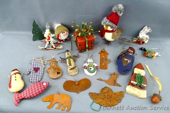 Variety of Christmas ornaments incl. snowmen, Santa, birds and more.