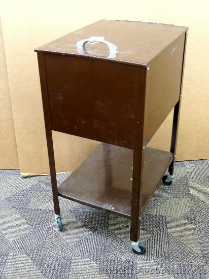 Unique metal file cabinet on casters. Approx. 13-1/2" w x 17-1/2" d x 27-1/2" h. Paint is peeling on