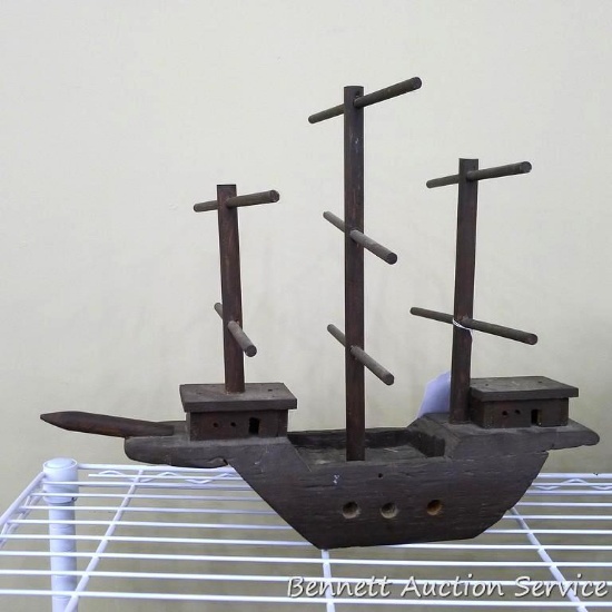 Folk art ship measures 18" x 9" x 14 - 1/2" tall.