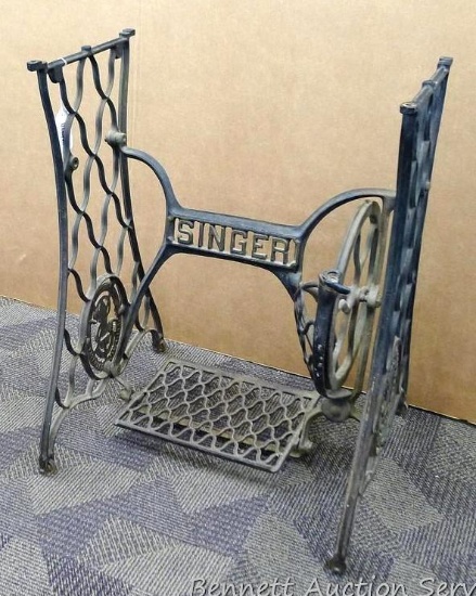 Antique Singer sewing machine stand. Measures 22" l x 18" w x 28" h. Make a great stand for a table.