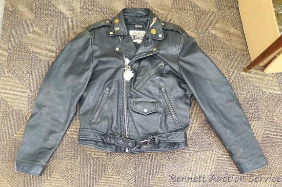 Open Road Leather motorcycle jacket with zip out lining, size 40. Has belted bottom and several