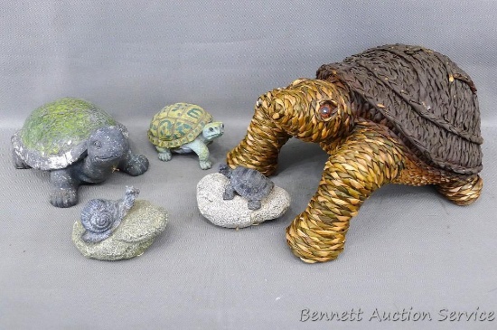 Assortment of turtles figurines incl. a woven one. Largest turtle is 12" l x 8" w x 7" h.