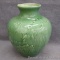 Red Wing art pottery vase is stamped on bottom. Pretty glazed vase show uniform crazing throughout.