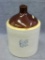 One gallon stoneware jug by Western Stoneware Co. is in very good condition with only a bit of tape