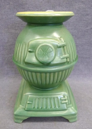 Red Wing art pottery pot belly stove planter is marked on bottom '765'. Planter stands 8" tall and