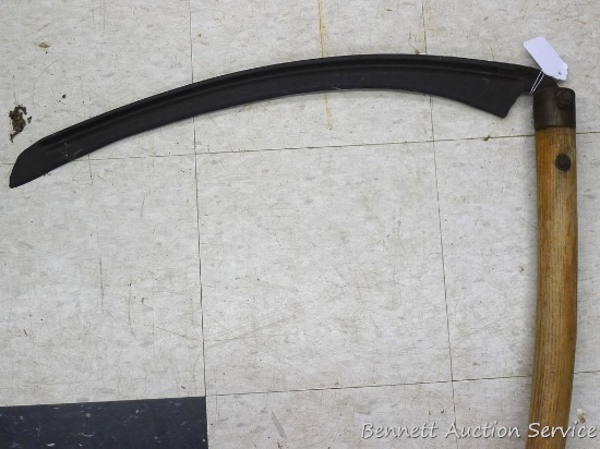Antique scythe is in good condition, nearly 5-1/2' long overall.