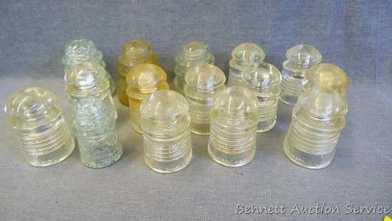 Collection of clear telephone pole insulators, largest is 3"x 4-1/2".
