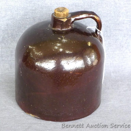 One gallon bee hive jug with brown glaze is marked on bottom 'Minnesota Stoneware Co. Red Wing'.