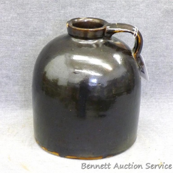 One gallon wide mouth stoneware jug is in overall good condition with only a couple chips noted at