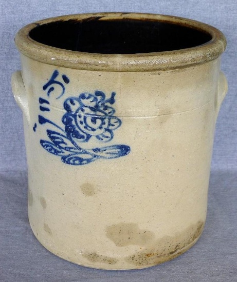 Five gallon salt glazed stoneware crock with pretty blue floral marking close to left handle. Old