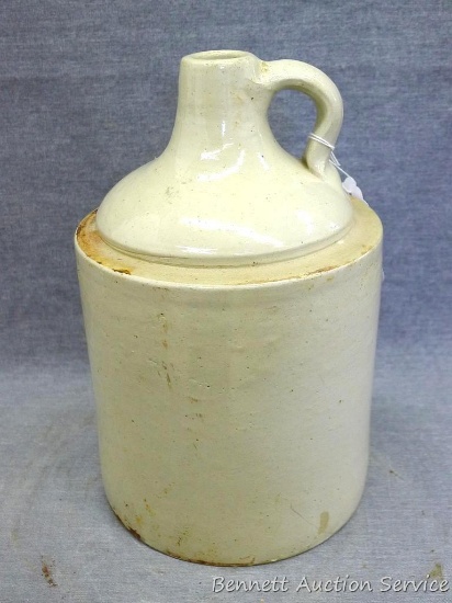 One gallon stoneware jug is unmarked and in overall good condition with only one chip noted at foot.