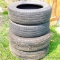 Two Kelly tires size P265/70R17. Both show wear. Two Michelin P225/65R17. Both show wear and weather