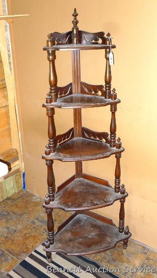 Vintage wooden corner shelf unit stands 5' tall and is about 2' across bottom shelf.